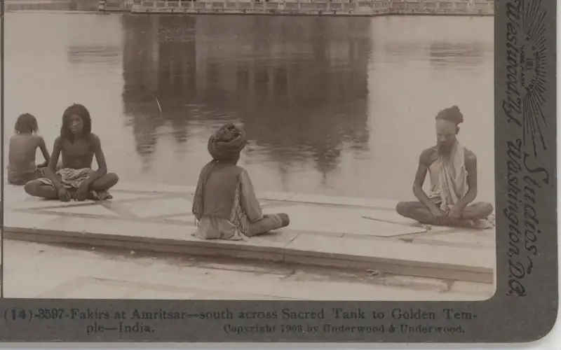 "Fakirs" meditating on the bank of the temple tank in the Golden Temple complex in Amritsa